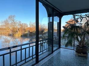 glass room looking over lake