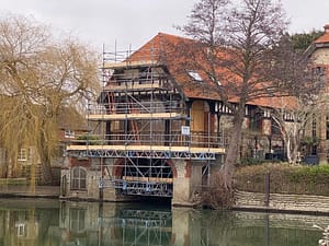 house being built looking over a lake