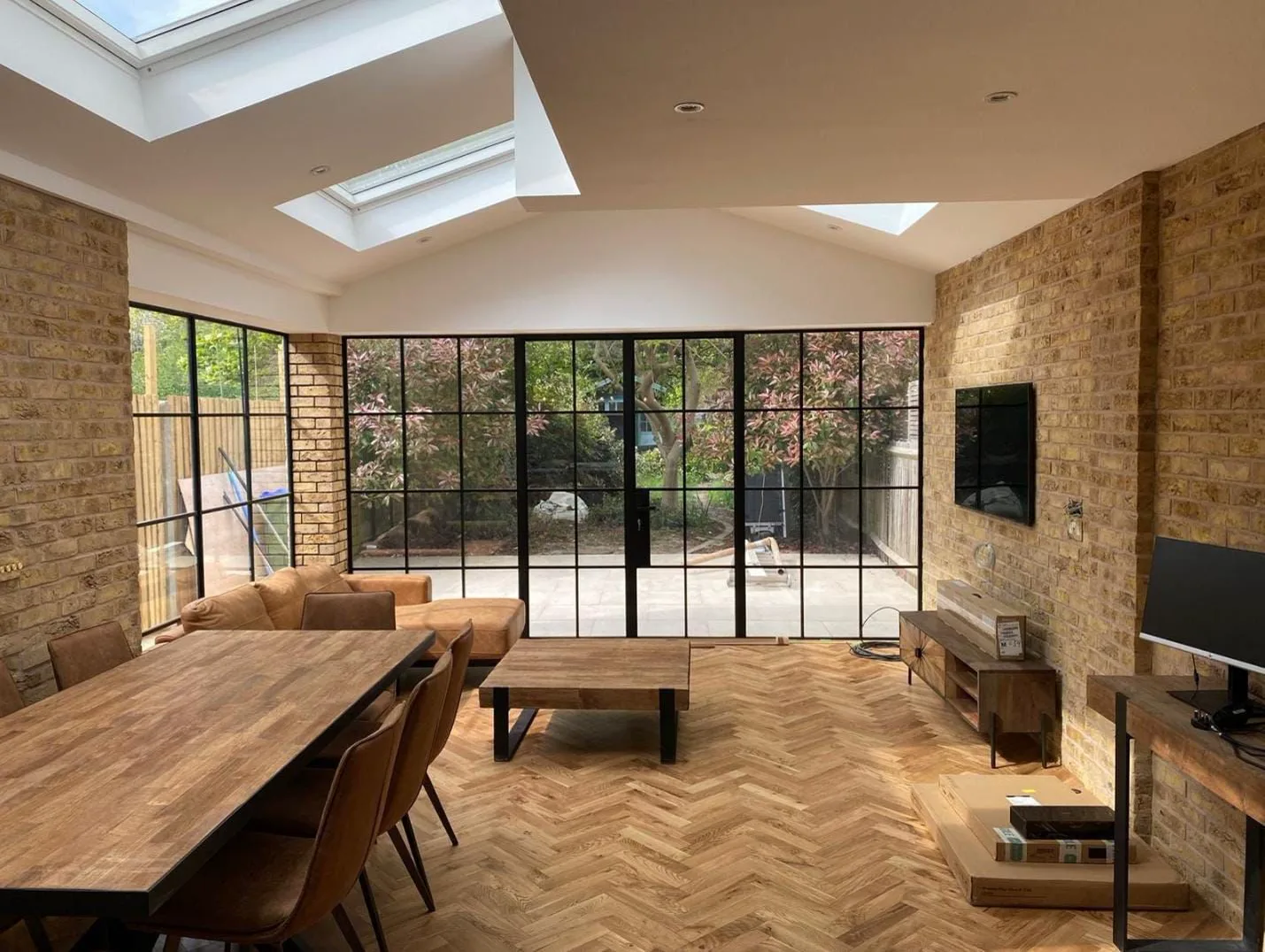 Bespoke open-plan renovation with oak joinery and steel-framed glazing